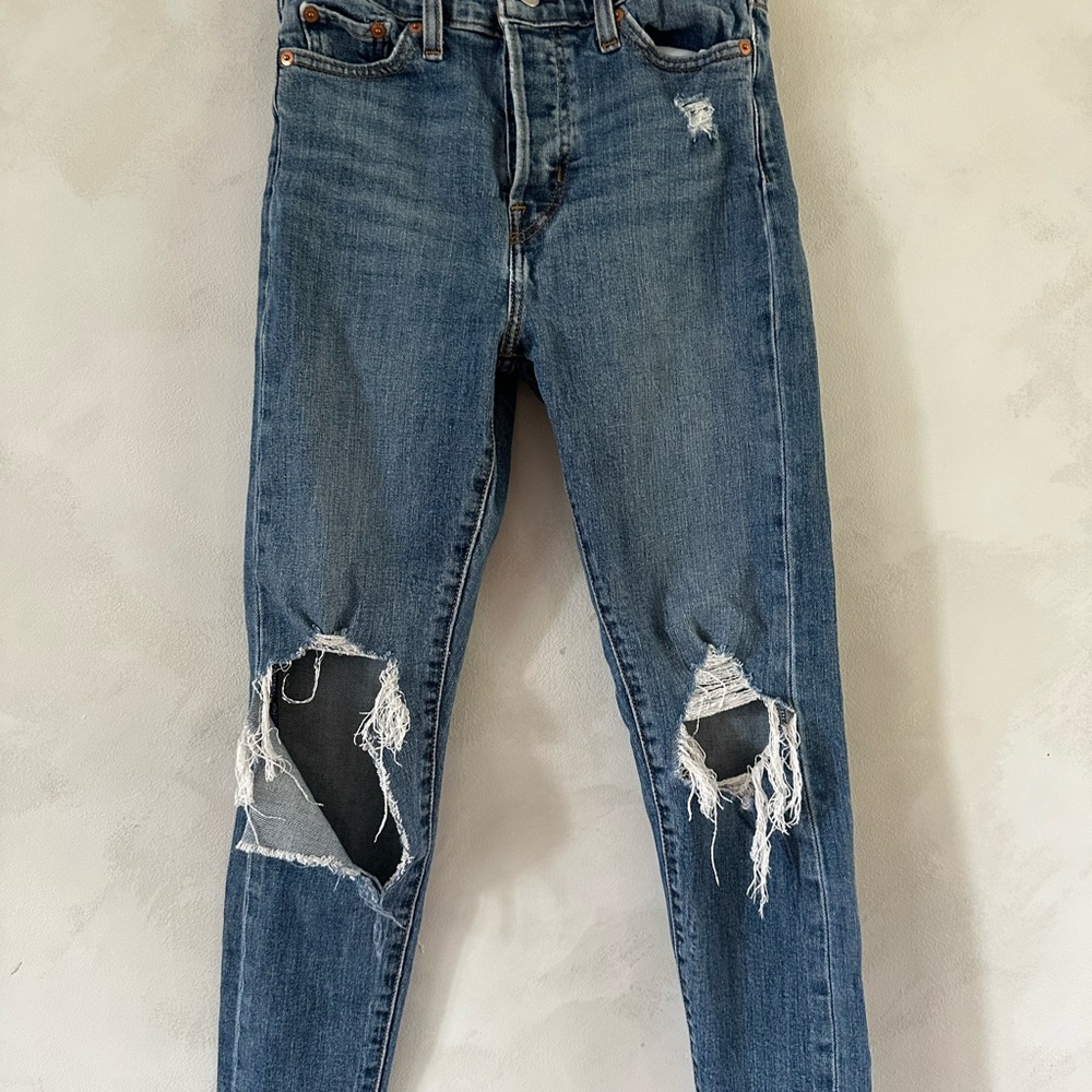 Distressed Levi Blue Jeans for Women